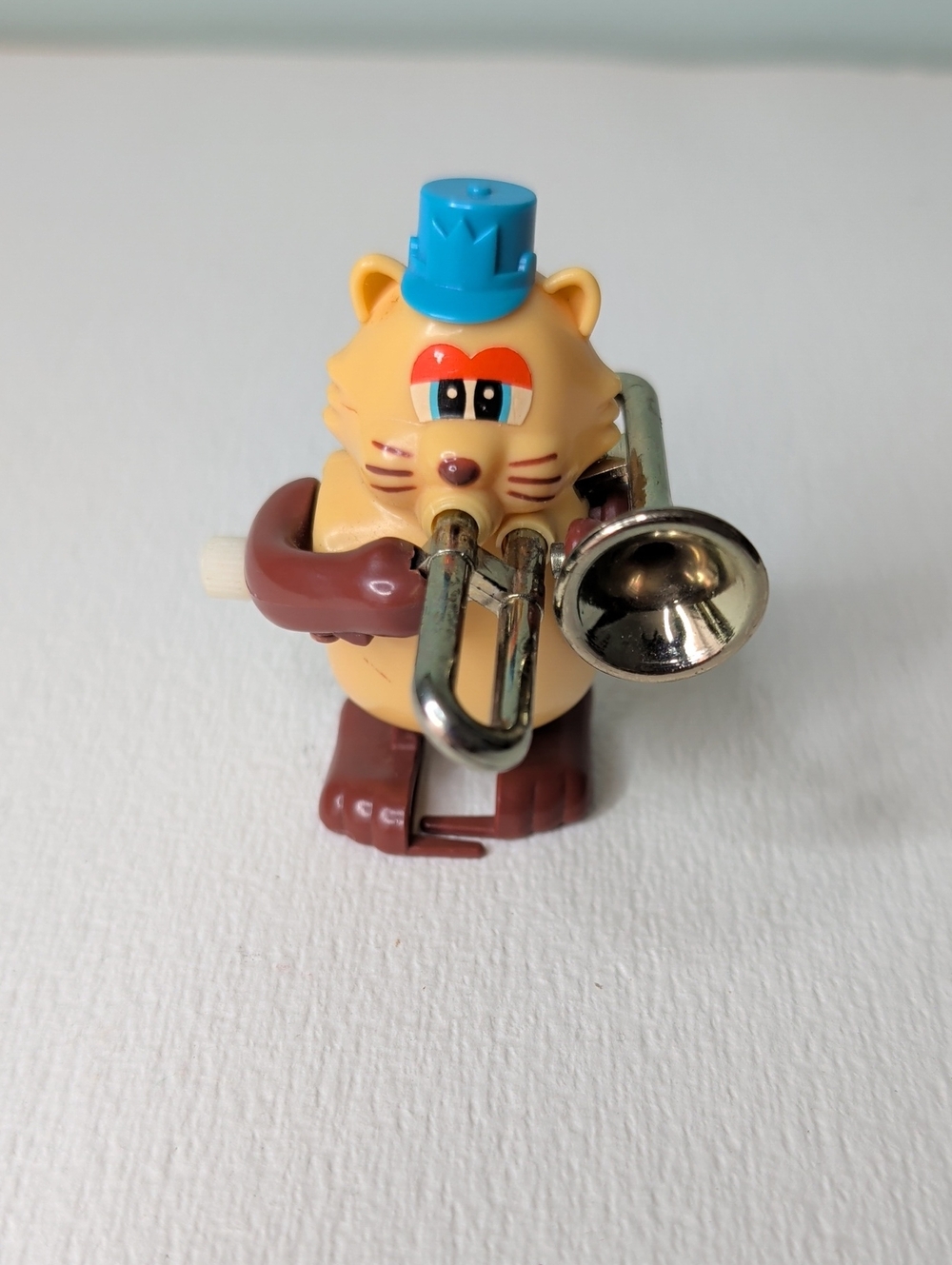 Yellow Cat Wind-Up Figure with Blue Hat and Brown Accents